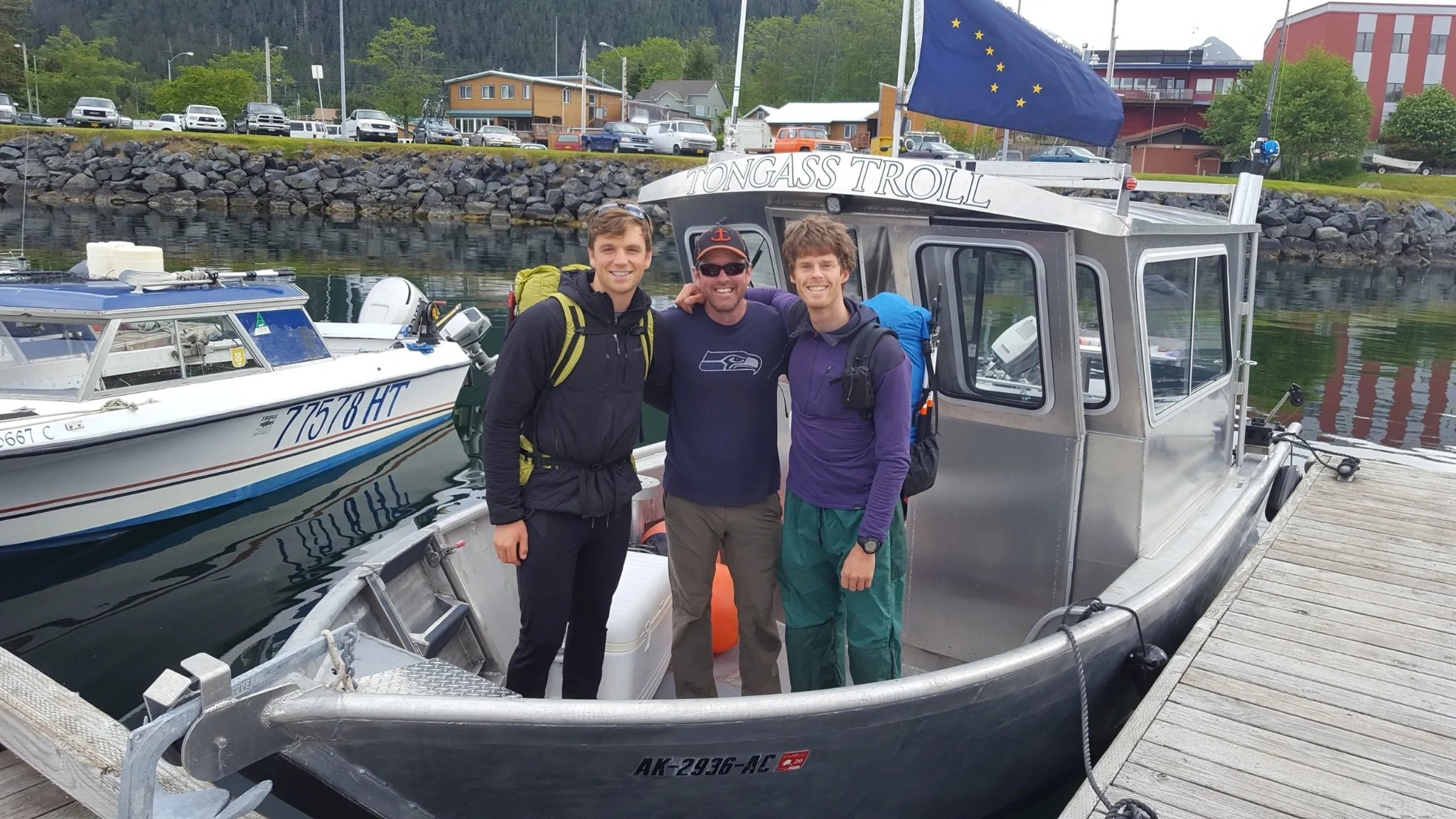 Captain Xander and guests posing in front of the Tongass Troll at Thomsen Harbor